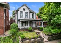 Charming two-story home with inviting front porch at 545 Fletcher Ave, Indianapolis, IN 46203