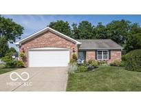 Charming brick ranch home with a well-manicured lawn and a two-car garage, offering curb appeal at 774 Courtney Cir, Danville, IN 46122