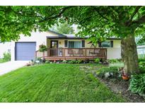 Charming single-story home with a welcoming front porch and lush green lawn at 9042 Panorama Ct, Indianapolis, IN 46234