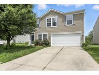 Inviting two-story home with a well-maintained lawn and a two-car garage at 1236 N Aberdeen Dr, Franklin, IN 46131