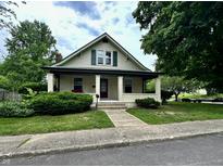 Charming two-story home with a covered front porch, landscaped yard, and inviting curb appeal at 388 N Ohio St, Martinsville, IN 46151