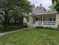 Charming single Gathering home featuring a lovely lawn and covered front porch at 414 E Main St, Plainfield, IN 46168