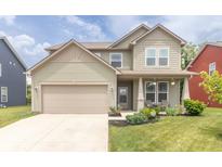 Charming two-story home featuring an attached garage and a well-maintained front yard at 1156 Brockton Ct, Greenfield, IN 46140