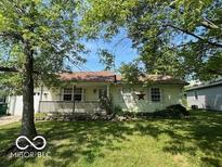 Charming single-story home featuring a inviting front porch and beautiful lawn at 1919 Manor Dr, Lebanon, IN 46052