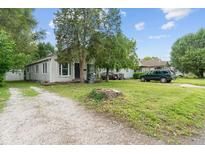 Charming single-story home with a quaint front yard and driveway offers great curb appeal at 4517 E 16Th St, Indianapolis, IN 46201