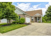 Charming single-story home with a brick facade, attached garage, and well-manicured lawn at 5217 Dunewood Way # 3002, Avon, IN 46123