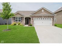 Charming single-Gathering home featuring a manicured lawn and attached two car garage at 6644 Aberdeen Dr, McCordsville, IN 46055