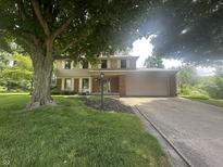 Charming two-story home with a spacious driveway and an attached two-car garage at 1289 Woodcreek Dr, Greenwood, IN 46142