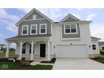 Charming two-story home featuring a covered front porch and a two-car garage at 17110 Cowbell Dr, Noblesville, IN 46060