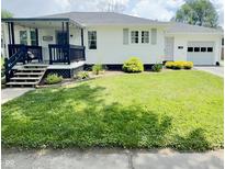 Charming single-story home with a well-maintained lawn and inviting front porch with a nice railing at 249 N Mill St, Plainfield, IN 46168