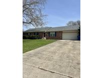Charming single-story brick home with a well-maintained lawn, driveway, and attached garage at 5453 David St, Indianapolis, IN 46226
