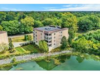 Beautiful aerial view of a multi-Gathering home surrounded by lush greenery and scenic waters at 6640 Page Blvd # 101, Indianapolis, IN 46220