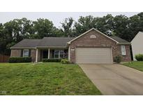 Charming brick ranch home with a two-car garage and well-maintained lawn at 7440 Oakview Dr, Avon, IN 46123