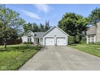 Charming single-Gathering home featuring a two-car garage, manicured lawn, and traditional architecture at 8929 Sunburst Cir, Indianapolis, IN 46227