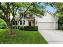 Charming two-story home with a well-manicured lawn and attached two-car garage, creating a welcoming curb appeal at 13020 Lombard Ct, Fishers, IN 46038