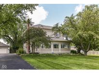 Charming two-story home with mature trees and a well-manicured lawn offering great curb appeal at 1325 Fordice Rd, Lebanon, IN 46052