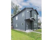 Charming two-story home with well-manicured lawn and modern architectural details at 1425 Kennington St, Indianapolis, IN 46225