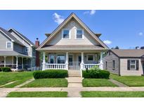 Charming two-story home featuring a classic porch, well-maintained lawn, and inviting curb appeal at 238 S 5Th Ave, Beech Grove, IN 46107
