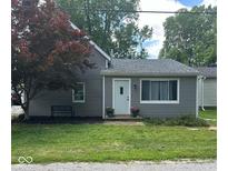 Charming home with gray siding, well-maintained lawn, and inviting front entrance at 335 Park St, Noblesville, IN 46060