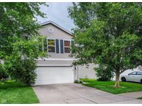 Charming two-story home with vinyl siding, attached garage, and well-maintained front lawn at 2355 Collins Way, Greenfield, IN 46140