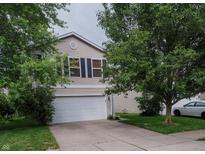Charming two-story home featuring a two-car garage and well-maintained landscaping at 2355 Collins Way, Greenfield, IN 46140