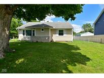 A charming single-story home with a well-maintained lawn and a mix of stone and siding exterior at 3059 Tansel Rd, Indianapolis, IN 46234