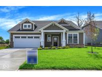 Charming home with a two-car garage, manicured lawn, and a welcoming front porch at 7205 Rose Hill Ave, Brownsburg, IN 46112