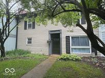 Charming two-story home with a well-maintained lawn and traditional siding, enhancing its curb appeal at 9458 Fordham St, Indianapolis, IN 46268
