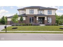 Beautiful two-story home with brick and siding exterior, manicured lawn, and inviting curb appeal at 20450 Chatham Hills Blvd, Westfield, IN 46074