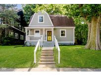 Charming front exterior of a well-maintained home with a landscaped lawn and inviting porch at 3709 Central Ave, Indianapolis, IN 46205