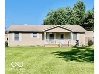 Charming single-story home featuring a cozy front porch and a well-maintained lawn at 409 N Kyle St, Edinburgh, IN 46124