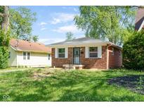 Charming single-story brick home with a well-manicured lawn and inviting curb appeal at 4904 E 14Th St, Indianapolis, IN 46201