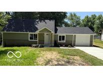 Charming single-story home with manicured front yard and attached one car garage at 7529 N Green Meadows, Fairland, IN 46126