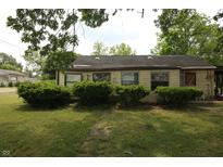 Charming single-story home with mature landscaping and a classic design at 1325 N Gavin St, Muncie, IN 47303