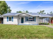 Charming single-story home with white siding, blue trim, and a well-maintained lawn at 2829 Dakota Dr, Anderson, IN 46012