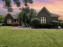 Charming single-story brick home with manicured lawn and walkway, creating inviting curb appeal at 3893 Bent Tree Ln, Greenwood, IN 46143