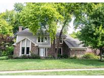 Charming two-story home featuring a well-manicured lawn and mature trees in a desirable neighborhood at 4976 Rockne Cir, Carmel, IN 46033