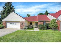 Charming single-story home featuring a red roof, brick accents, and a well-manicured front yard at 6402 Friendship Cir, Indianapolis, IN 46268