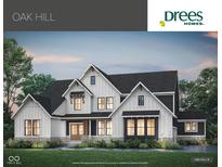 Beautiful exterior of the Oak Hill model featuring white and dark siding and coordinated trim at 10201 - Lot 2 N Alford Rd, Fortville, IN 46040