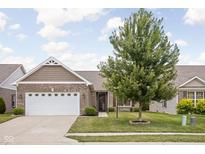 Charming home with a well-maintained lawn and attractive landscaping at 1418 Blackthorne S Trl, Plainfield, IN 46168