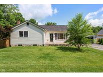 Charming single-story home with a well-maintained lawn and inviting curb appeal at 402 W Clinton St, Danville, IN 46122