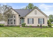 Charming single-Gathering home with a brick facade, manicured lawn, and a welcoming front entrance at 5299 Breakers Way, Carmel, IN 46033