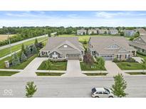 Beautiful single-Gathering home featuring a well-maintained lawn, mature trees, and an attached two-car garage at 10814 Matherly Way, Noblesville, IN 46060