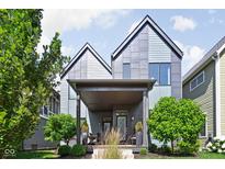 Modern two-story home featuring a covered porch and professional landscaping at 2140 Alabama St, Indianapolis, IN 46202