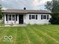 Charming one-story home with a well-manicured lawn and inviting curb appeal at 2650 Woodrow Ave, Indianapolis, IN 46241