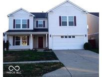Charming two-story home with white siding, a two-car garage, and a cozy front porch at 2931 Sentiment Ln, Greenwood, IN 46143