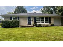 Charming single-story home with stone facade, manicured lawn, and mature landscaping at 336 Brookside Ln, Plainfield, IN 46168