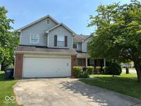 Charming two-story home with a two-car garage and well-maintained lawn at 4912 Atlanta St, Anderson, IN 46013
