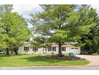 Traditional home exterior with tidy landscaping, mature shade trees, and great curb appeal at 6429 Walnut Way, Brownsburg, IN 46112