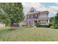 Charming two-story home with brick and siding, black shutters, landscaping, and a lush green lawn at 10107 Landis Blvd, Fishers, IN 46040